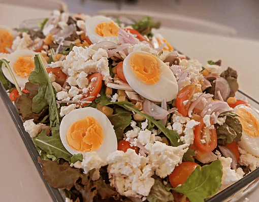 Mediterranean salad with eggs, feta and fresh vegetables