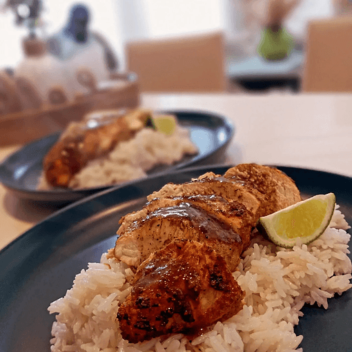 Grilled protein with rice and lime