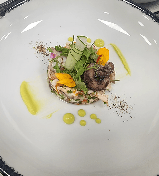 Seafood tartare with cucumber and edible flowers