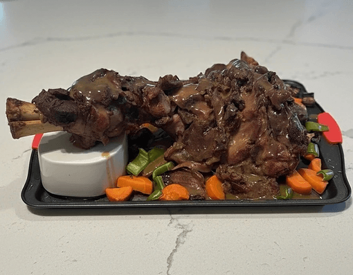 Slow-braised meat with roasted vegetables