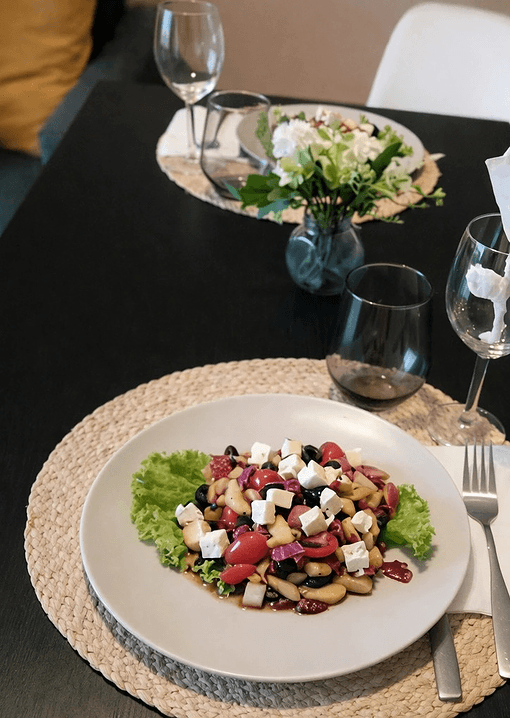 Fresh salad with beans, feta, and garden vegetables